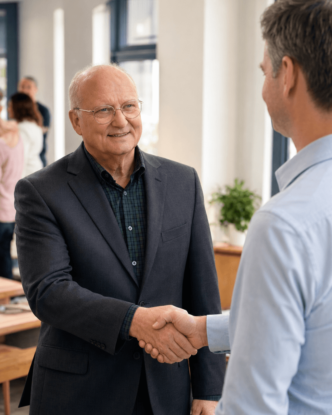 Randall Fryer shaking hands with a constituent